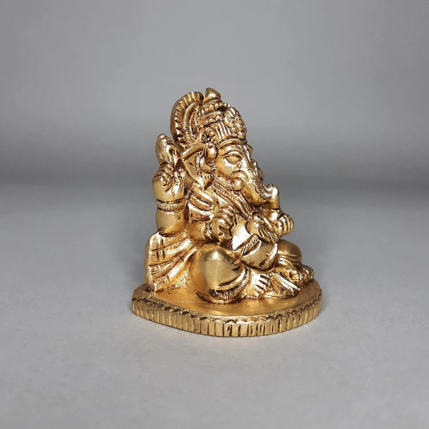 Brass Ganesha Sitting on Oval Base 2.5 in
