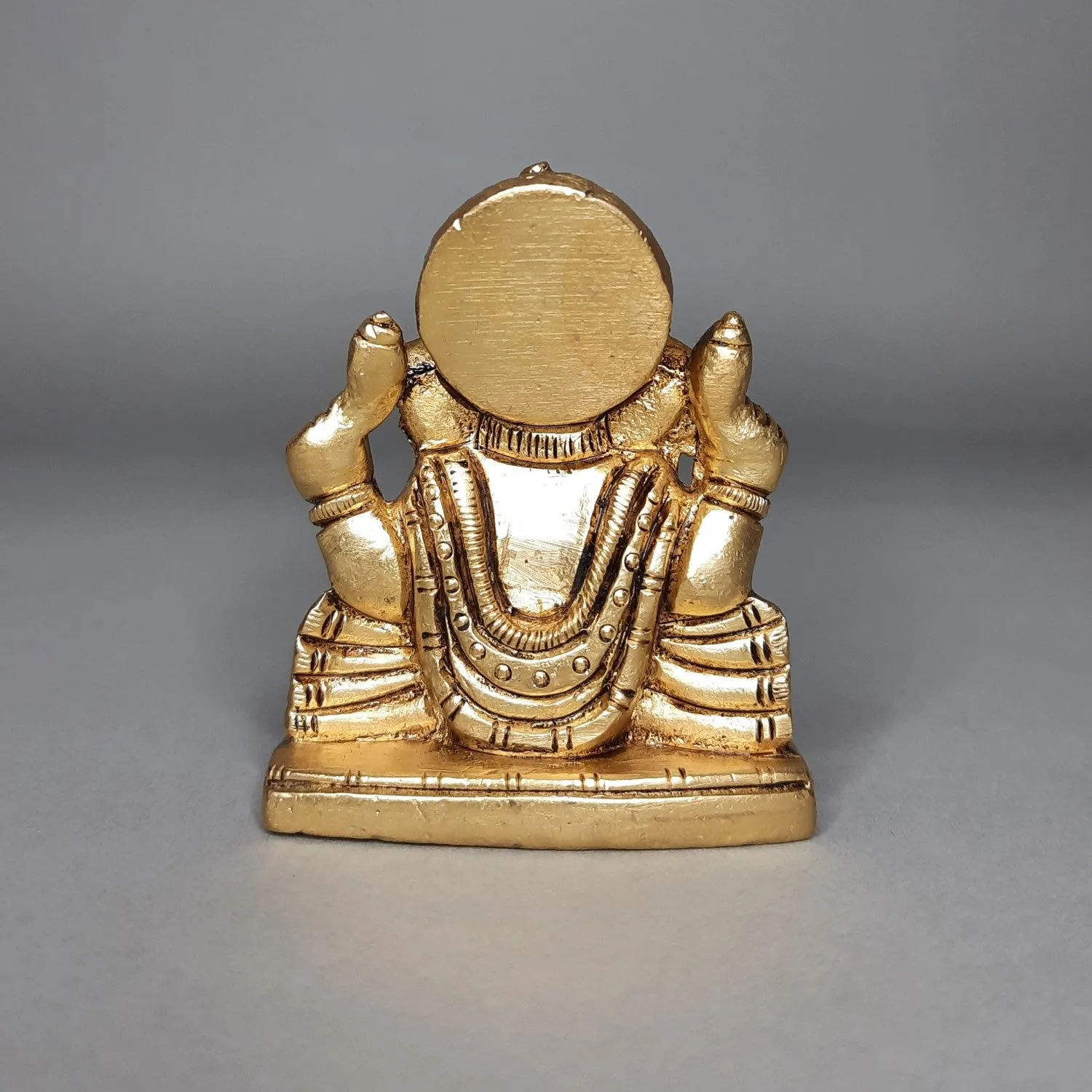 Brass Ganesha Sitting on Oval Base 2.5 in